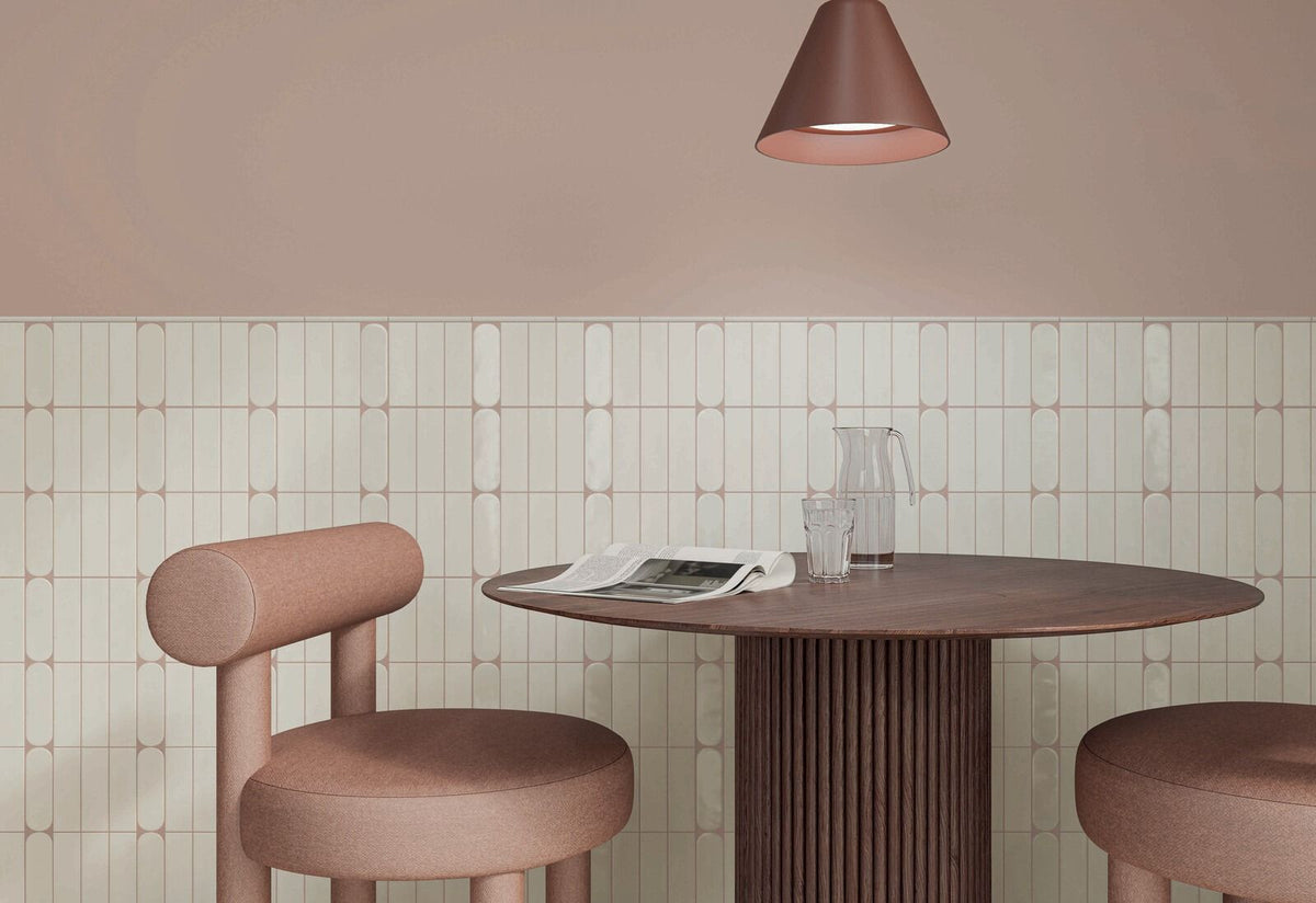Arrangement of Calema 2x6 White Gloss Oval Glazed Ceramic Wall Tiles, highlighting the subtle texture and variation.