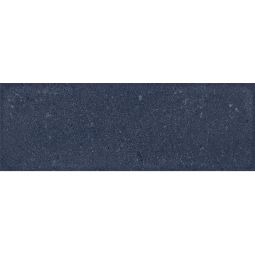 Close-up view of a single Camp 4"x12" Blue Rock ceramic wall tile, showing its textured surface and blue colour