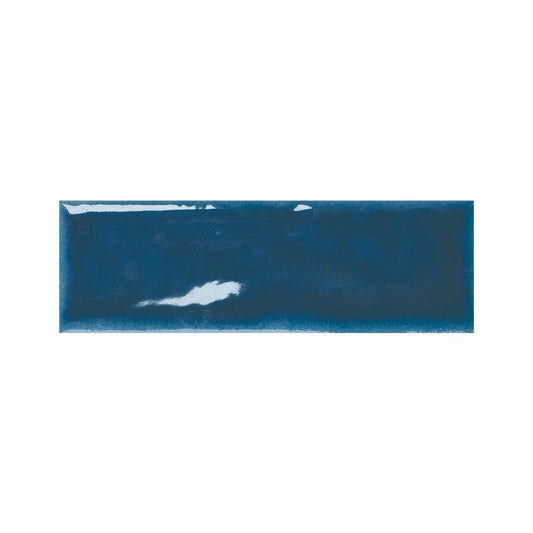 Stack of indigo gloss ceramic tiles showing their reflective surface