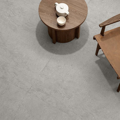 Detail shot of the texture and color variation present in the Canve Argile 24x24 glazed porcelain tile.