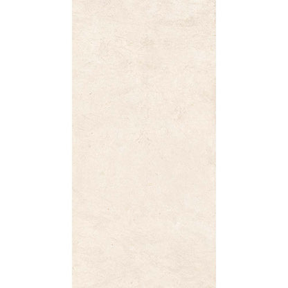 A stack of Canve Craie 12x24 inch glazed porcelain tiles, highlighting the rectified edges and consistent colour.
