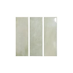 Close-up view of multiple Calema Tea Gloss 2x6 ceramic tiles arranged, showing their rectangular shape and glossy finish.