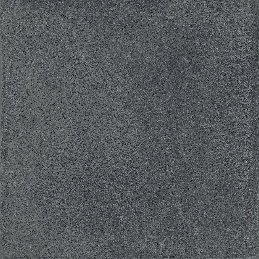 A tiled surface featuring Chalk 8x8 Dark Matte porcelain tiles, showcasing the overall pattern and slight variation.