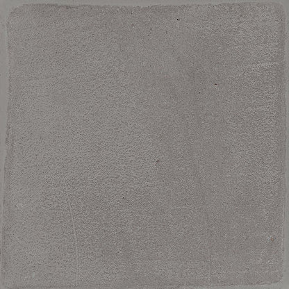Arrangement of multiple Chalk 8x8 Grey Matte tiles on a surface, highlighting the V2 slight variation.