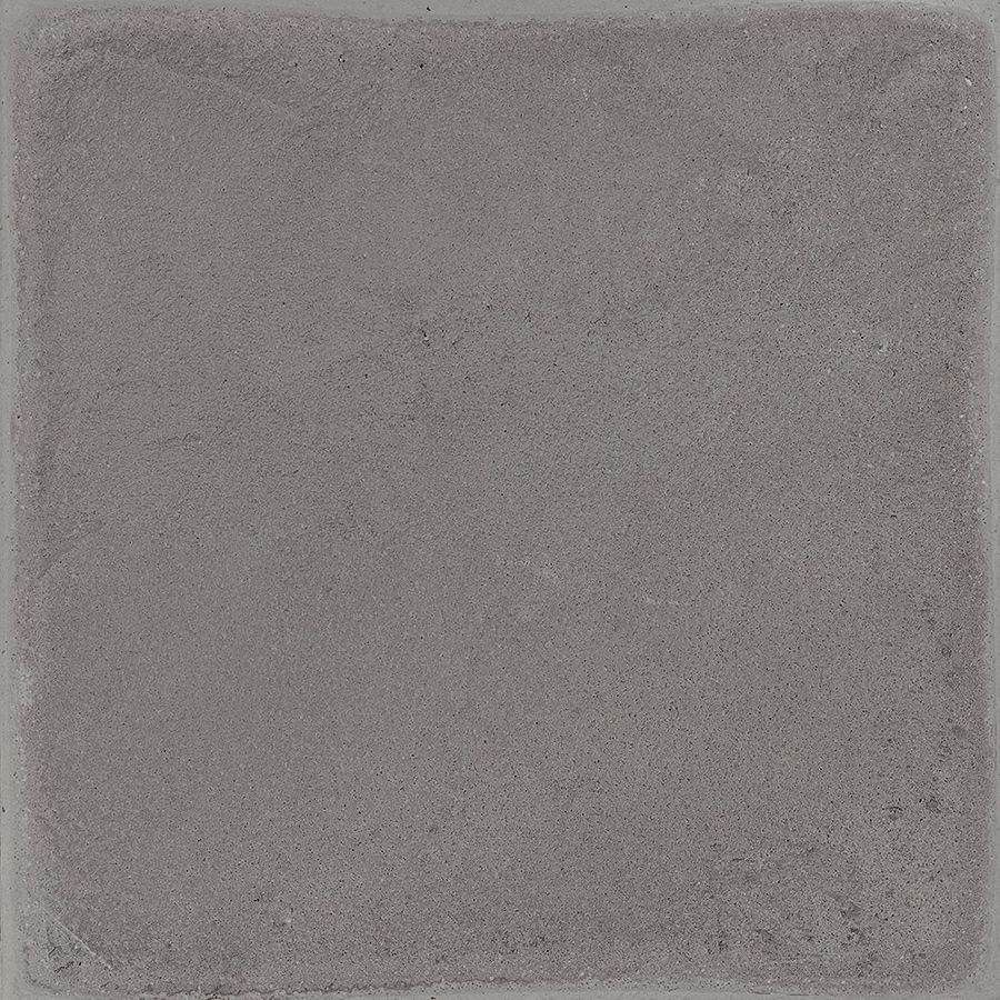 A stack of Chalk 8x8 Grey Matte porcelain tiles, showcasing the tile's thickness and non-rectified edge.