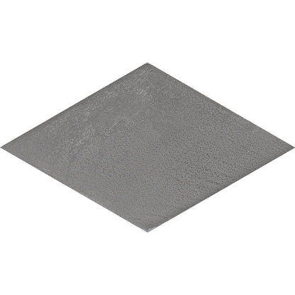 Arrangement of grey rhomboid tiles forming a geometric pattern on a floor or wall.