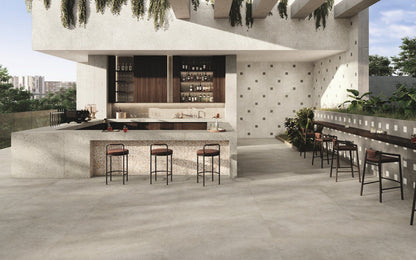 Another angle of the room scene, highlighting the subtle variation and overall aesthetic of the Civic Multicolour Warm tile in a living space.