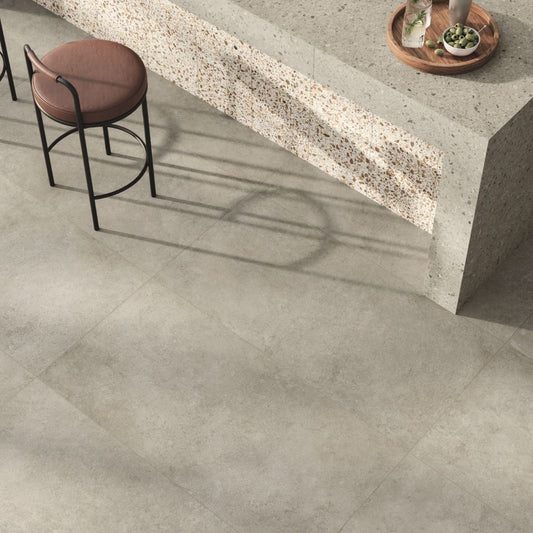 A room scene featuring the Civic Multicolour Warm matte porcelain tile installed on the floor, showcasing its modern terrazzo-inspired design.