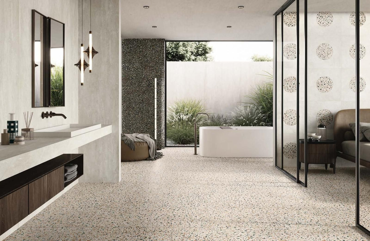 Room scene featuring Civic 24x24 Multicolour Black matte porcelain tile installed on a floor, showcasing its terrazzo-like design