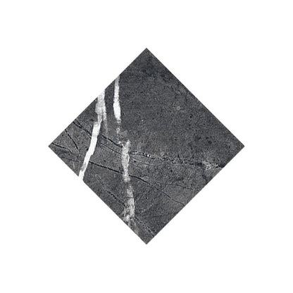 A sample board displaying the Classica Nero Marquina tile alongside other colors and sizes from the Classica collection.