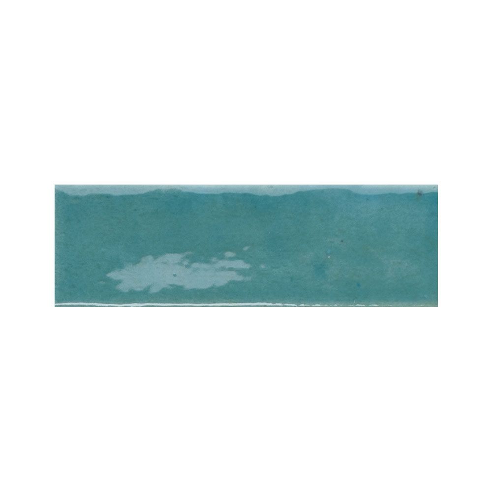 A group of Azur blue gloss tiles in a flat lay, showcasing the color consistency