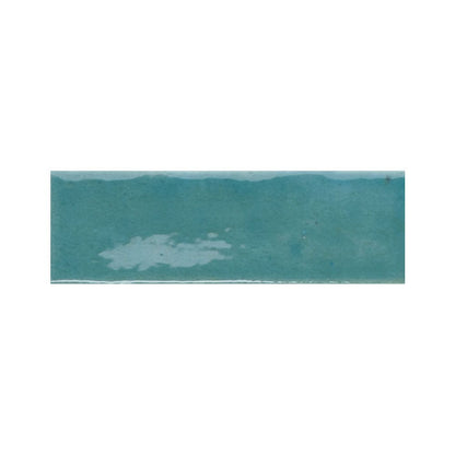 A group of Azur blue gloss tiles in a flat lay, showcasing the color consistency