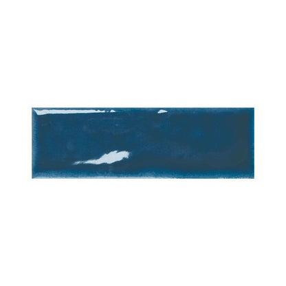 Stack of indigo gloss ceramic tiles showing their reflective surface