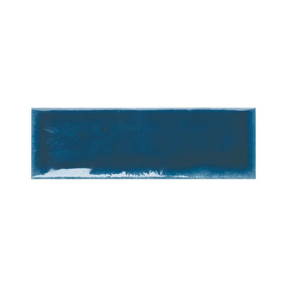 Room scene featuring indigo gloss ceramic tiles installed on a wall, possibly a kitchen backsplash or bathroom