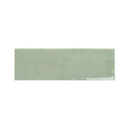 Close-up view of a single 2x5 inch kiwi green gloss ceramic tile