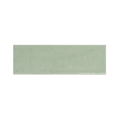 Stack of 2x5 inch kiwi green gloss ceramic tiles