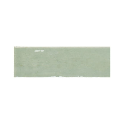 Detail shot of the gloss finish on a kiwi green ceramic tile