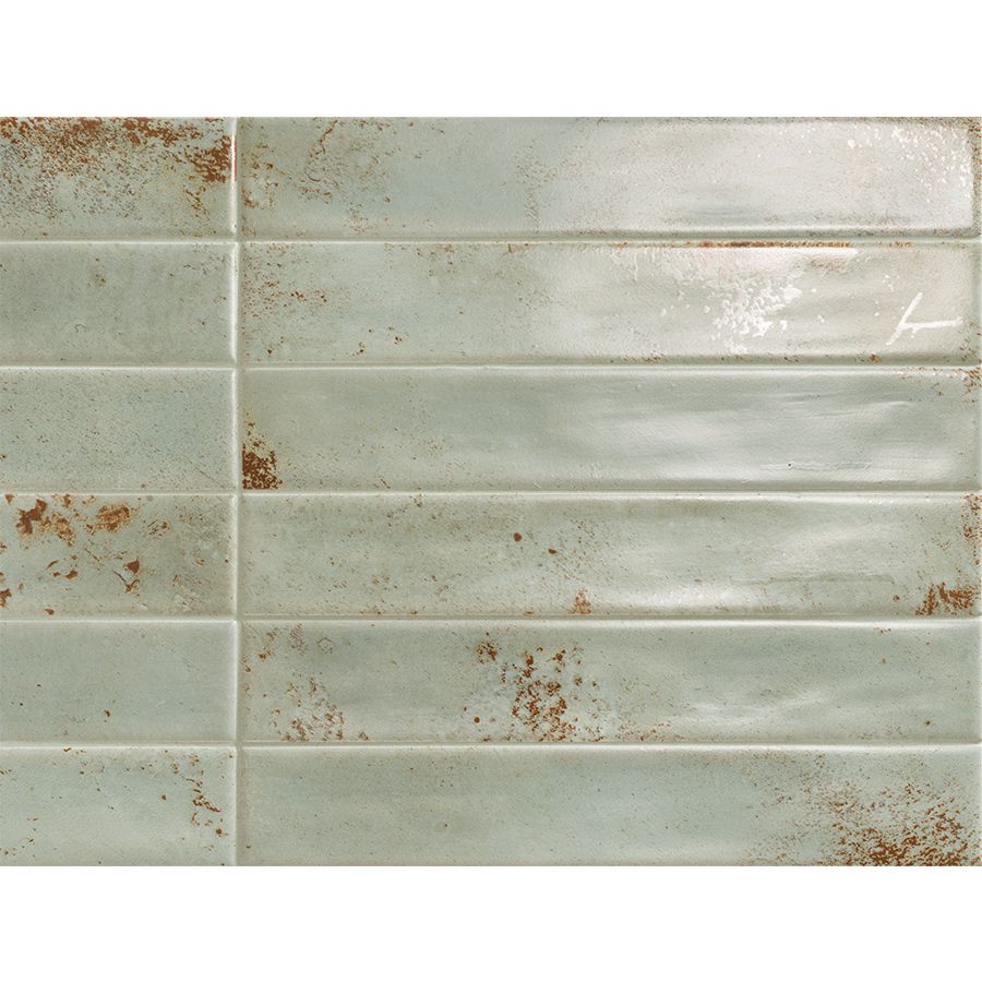 Arrangement of multiple Cool 2"x12" Emerald Satin ceramic wall tiles, highlighting the moderate variation in tone and pattern