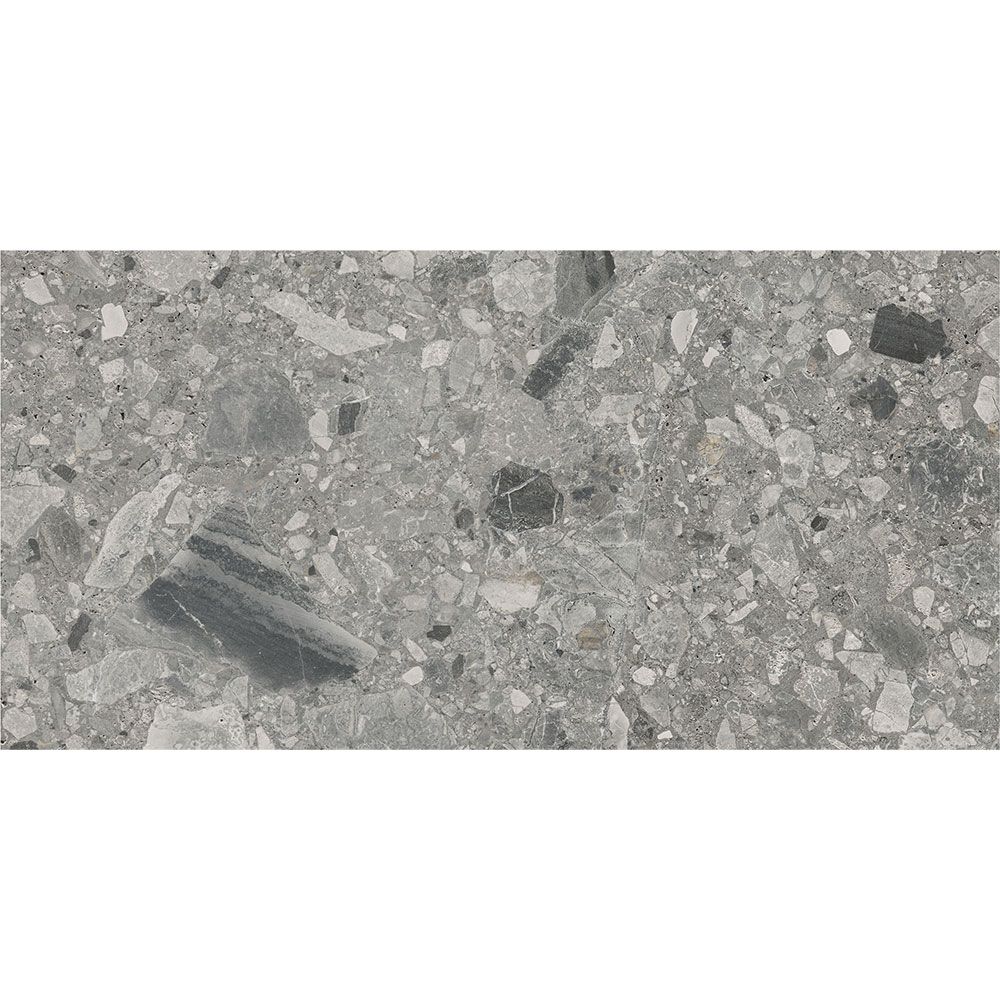 A sample of the Ceppo Grey Matte tile next to a tape measure to show its 12x24 size