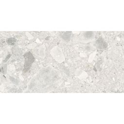 Close-up view of a single Ceppo Ivory Matte porcelain tile showing its fragmented mineral pattern