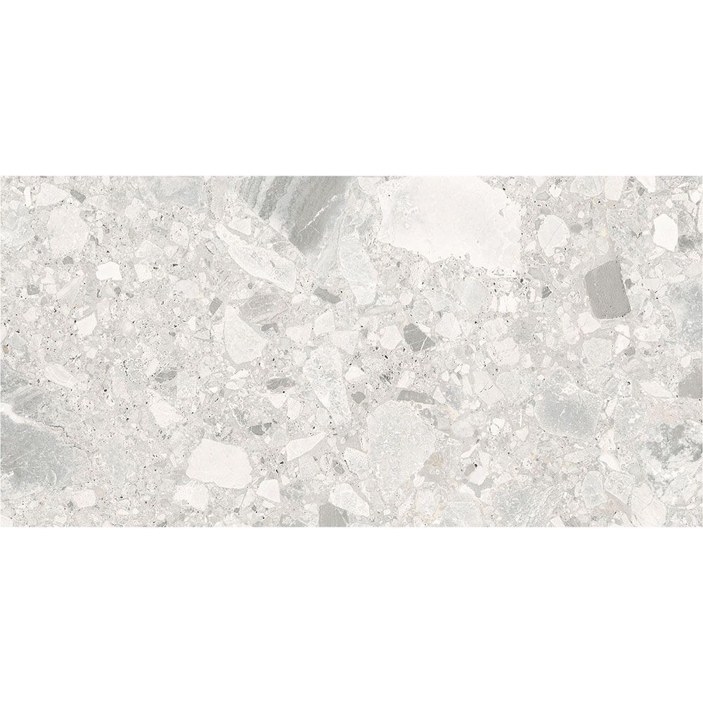 A stack of Ceppo Ivory Matte porcelain tiles, illustrating their consistent size and rectified edges