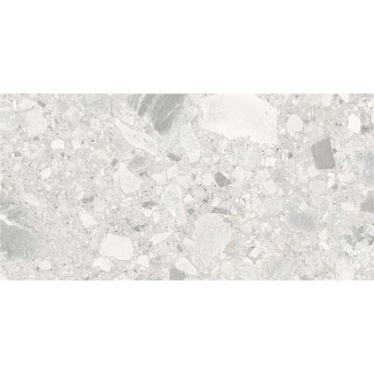A stack of Ceppo Ivory Matte porcelain tiles, illustrating their consistent size and rectified edges