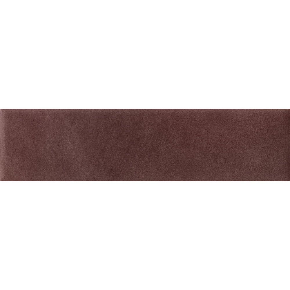 A room featuring Cera 2x9 Amaranto Jam matte porcelain wall tiles on a large wall surface