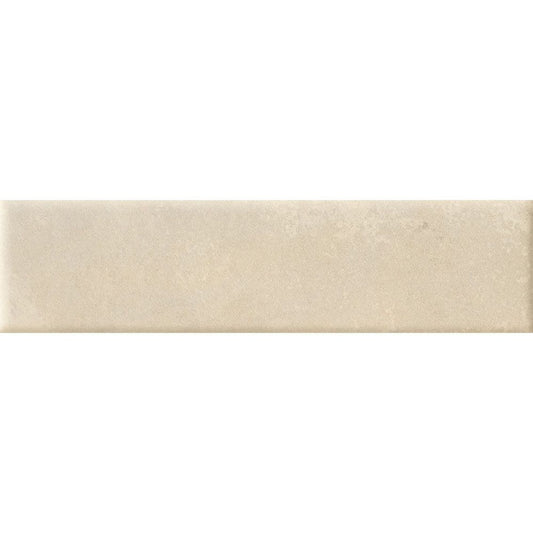 A stack of Cera 2"x9" Cashmere Melato Matte porcelain wall tiles, showing the uniform size and color consistency.