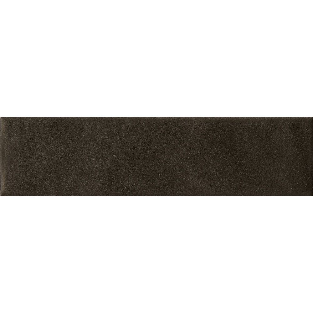 Angled view of the dark matte surface of the Cera Nero Inchiostro tile, highlighting its texture