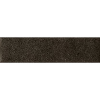 Angled view of the dark matte surface of the Cera Nero Inchiostro tile, highlighting its texture