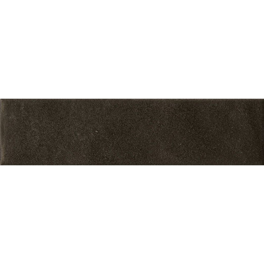 Angled view of the dark matte surface of the Cera Nero Inchiostro tile, highlighting its texture