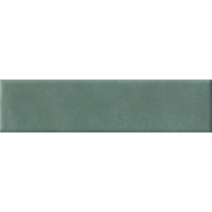 A stack of Cera Verde Foresta Matte porcelain wall tiles, showing the edge and thickness of the product.