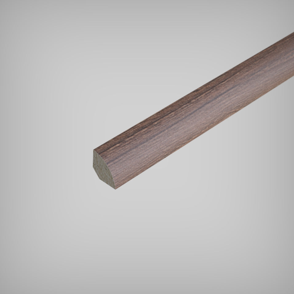 Close-up view of a light-colored Inhaus Quarter Round Moulding with a wood grain texture