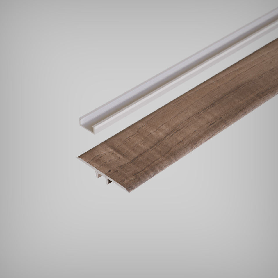 Close-up view of an Inhaus T-molding with a wood grain texture, designed for floor transitions